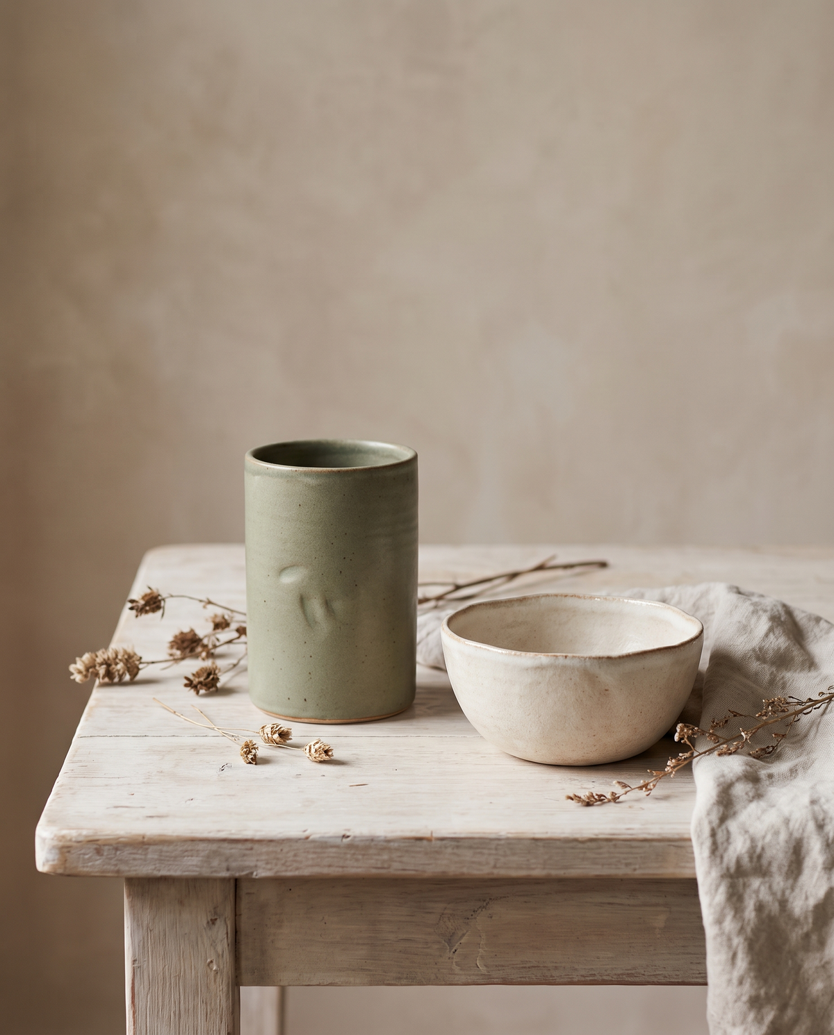 Handcrafted sage green stoneware vase and cream bowl